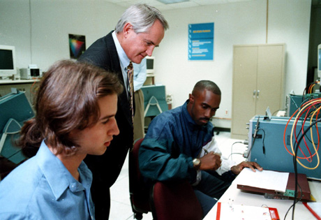 Chancellor Michael Hooker and 
graduate students at Hardware Teaching Lab Reception (Photo by Ted 
Richardson)