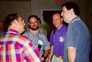 Phil Amburn (Ph.D. 1994), 
Sam Black (M.S. 1986), Dana Smith M.S. 1985), and Eric Grant (Ph.D. 1991)  
at SIGGRAPH Graphics Reunion (Photo by Jai Glasgow)