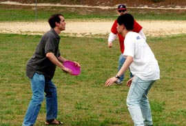 Students play ultimate frisbee at the Spring 1999 Picnic 
(Photo by Brent Insko)
