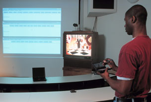 Olufisayo Omojokun uses a mobile computing device (Photo by 
Larry Ketchum)