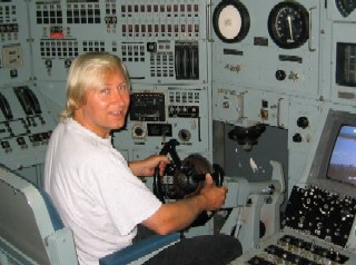 Kurtis at controls of nuclear submarine (deactivated - people have more sense than to put Kurtis in control of a real one!).