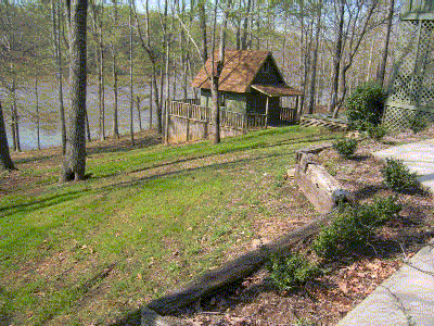 Backyard with Lake and playhouse