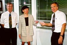 Sally Muller of Smallwood presenting grant 
to Timothy L. Quigg (left), and Stephen F. Weiss (Photo by Todd Gaul)