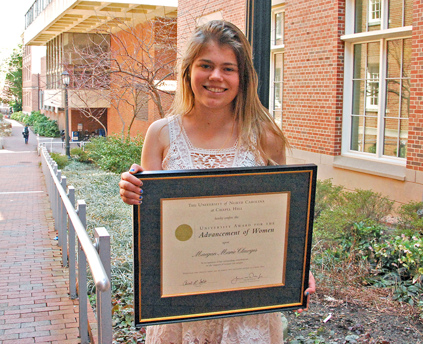 Maegan Clawges holding the 2015 University Award for the Advancement of Women